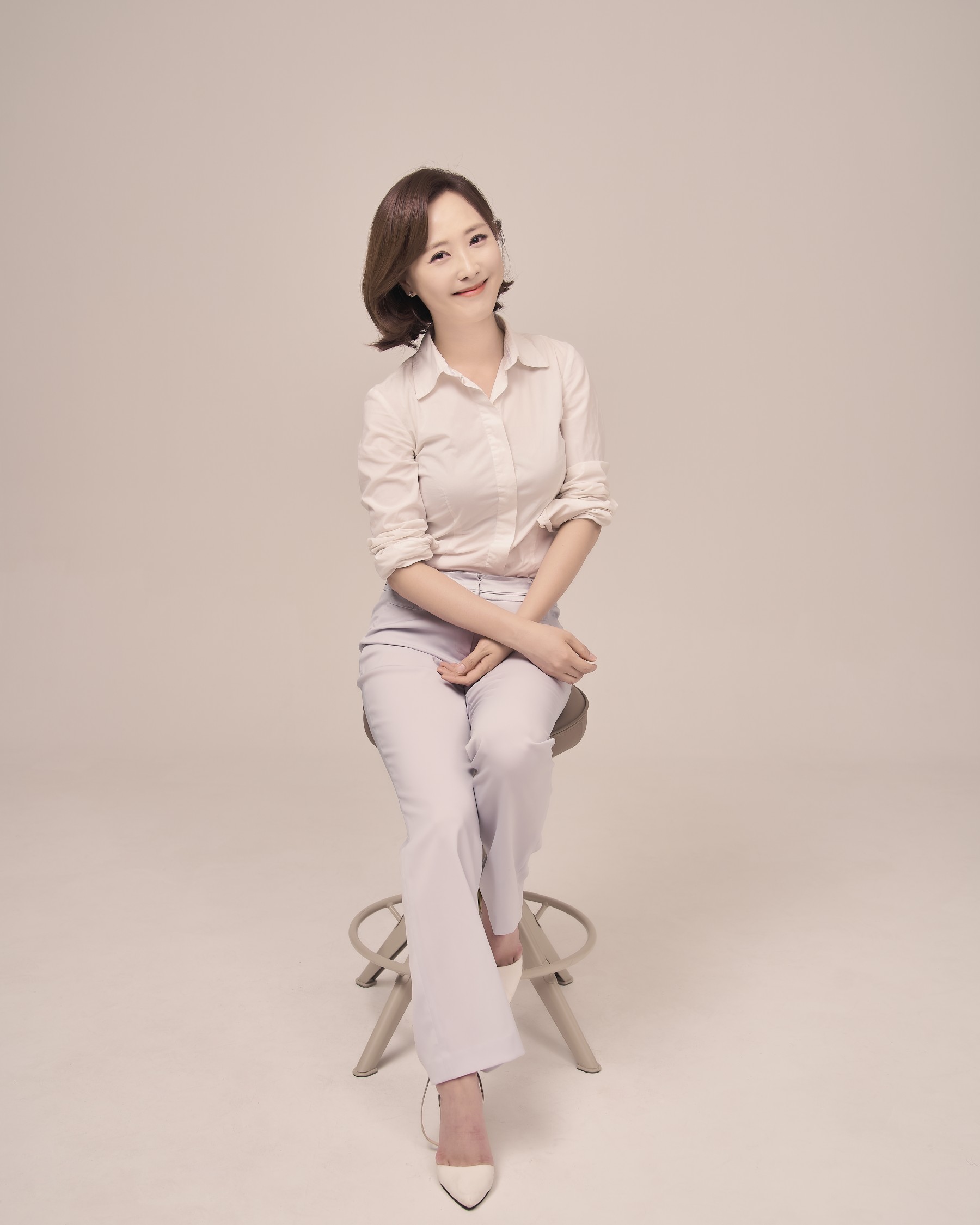 Saemi Nadine Jung seated in a studio portrait